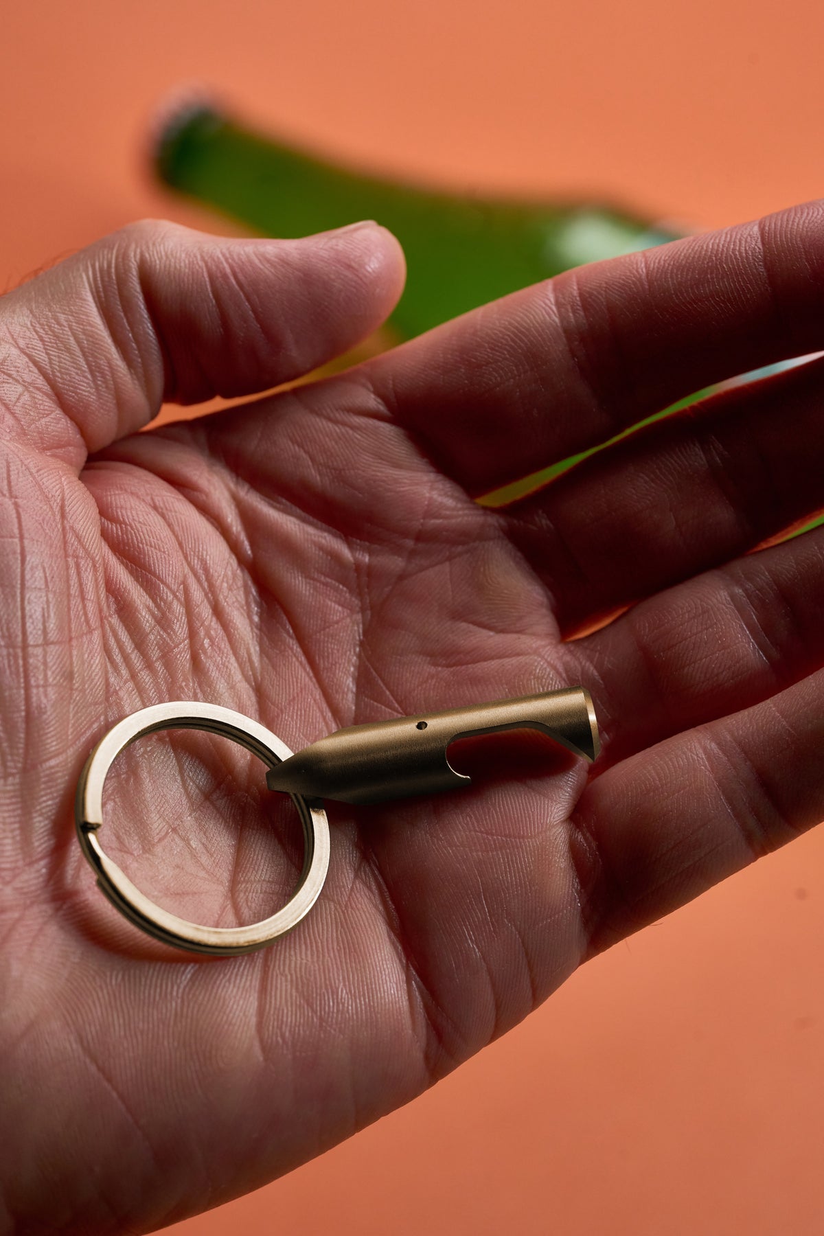 Bottle Opener - Brass held in an open palm