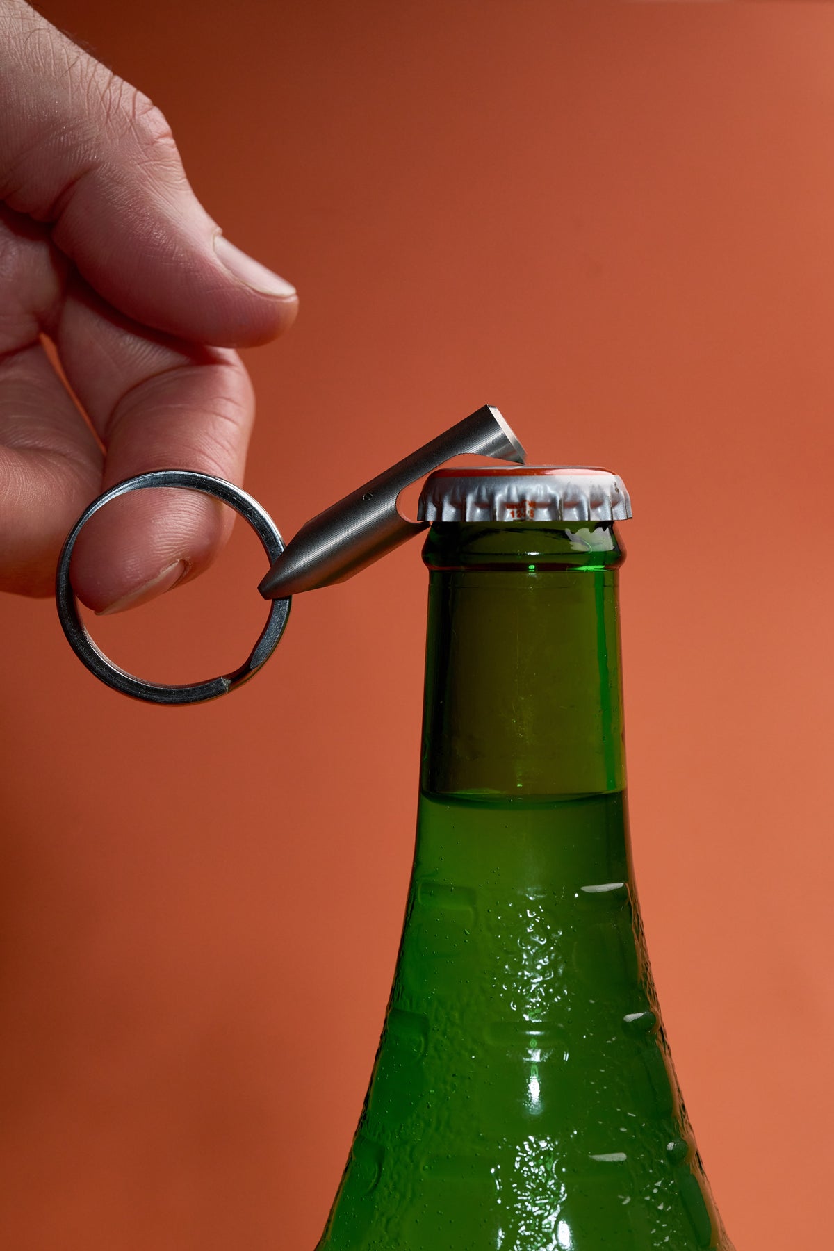 Bottle Opener - Steel lifting the cap off a bottle