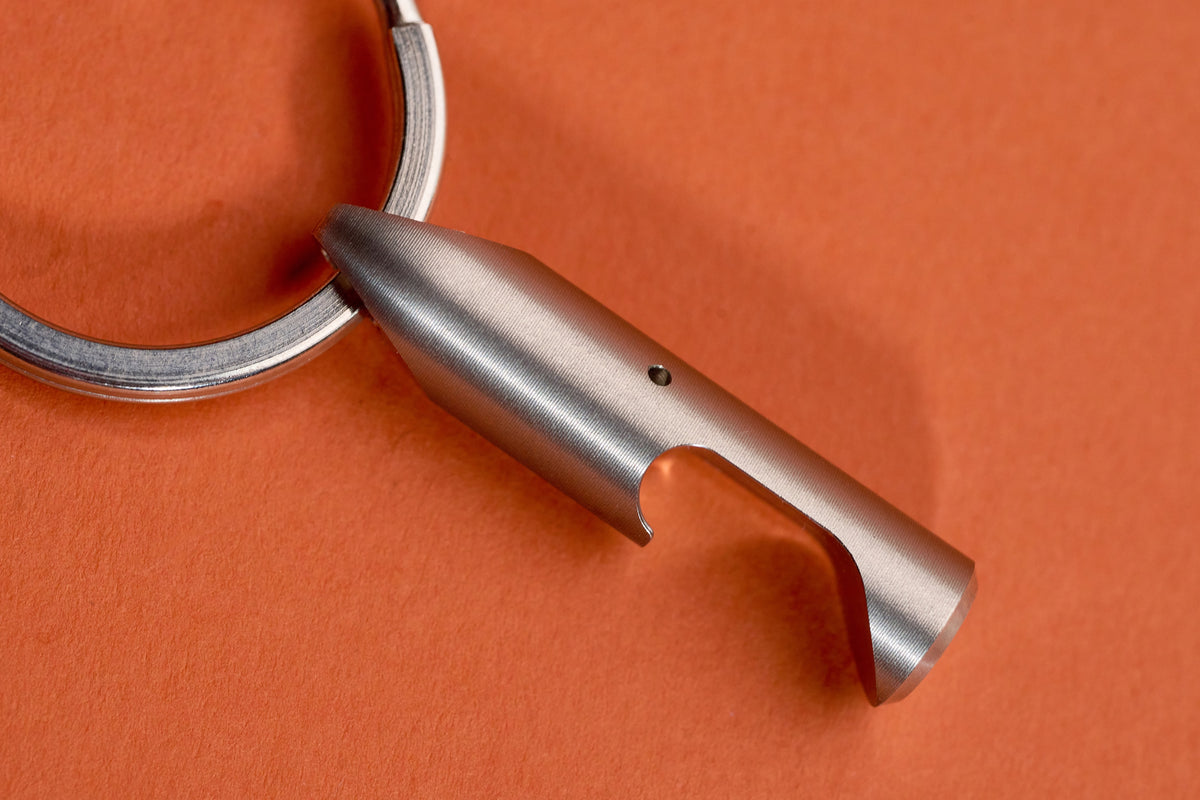 Bottle Opener - Steel close up of the cap-lifting slot