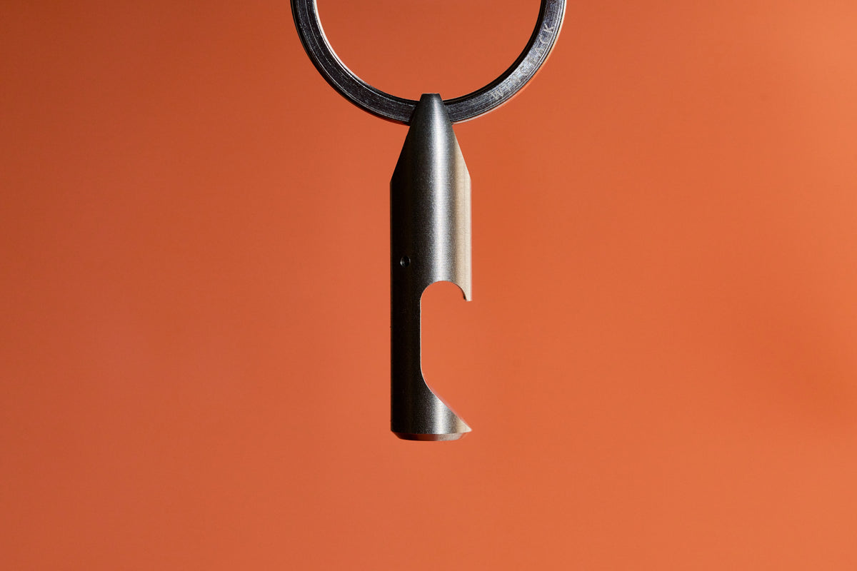 Bottle Opener - Titanium hanging from its key ring