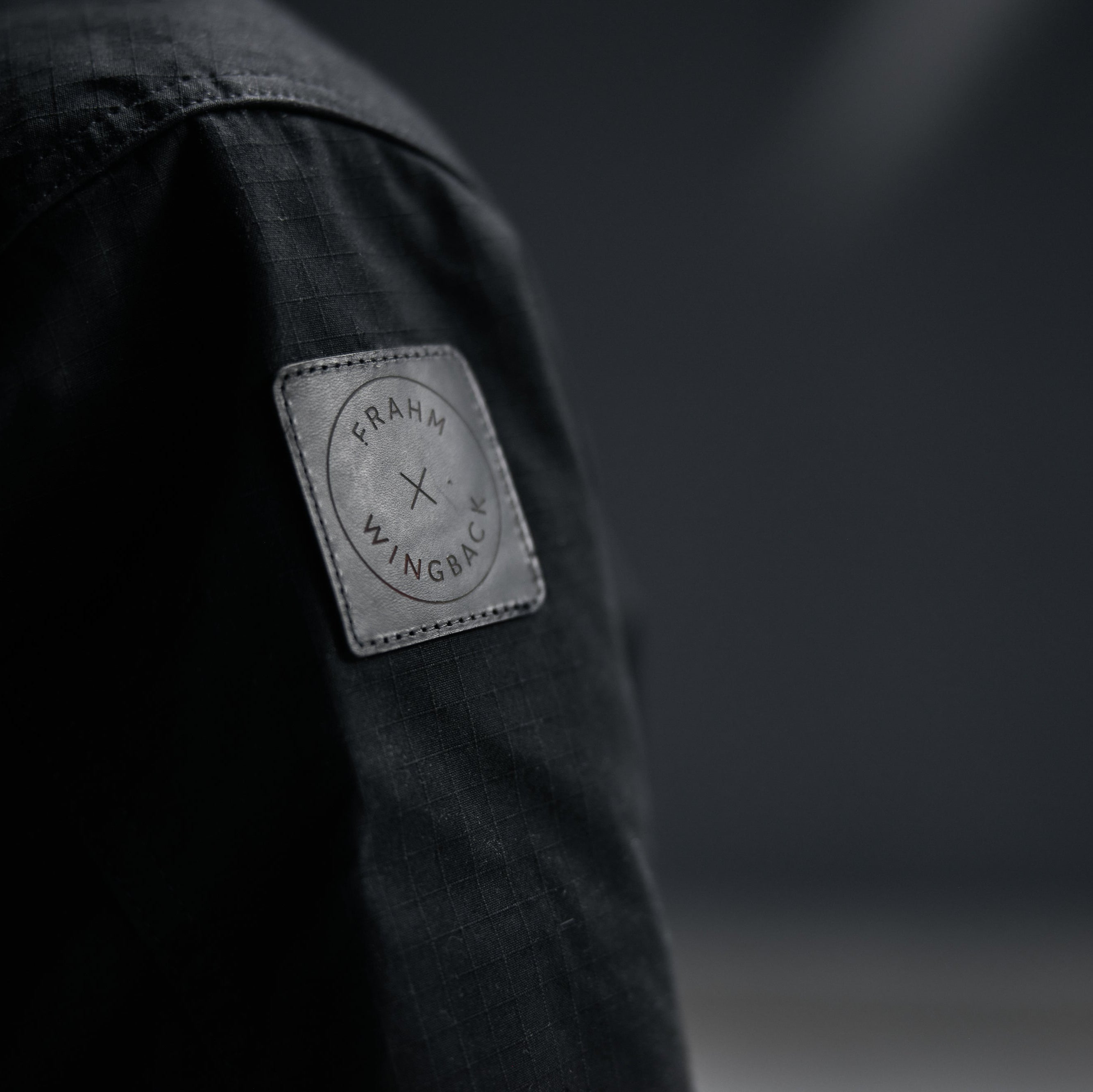 Close-up of a label on a dark jacket