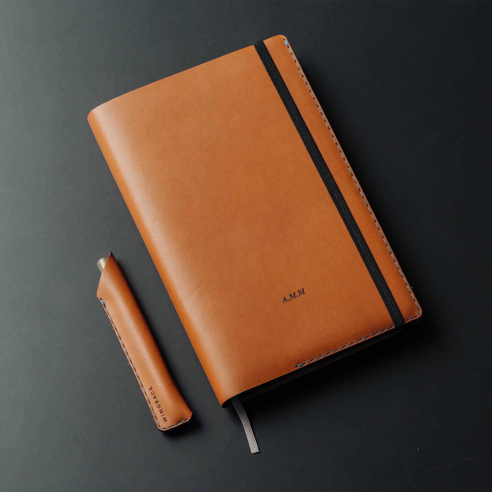 Notebook with matching pen holster