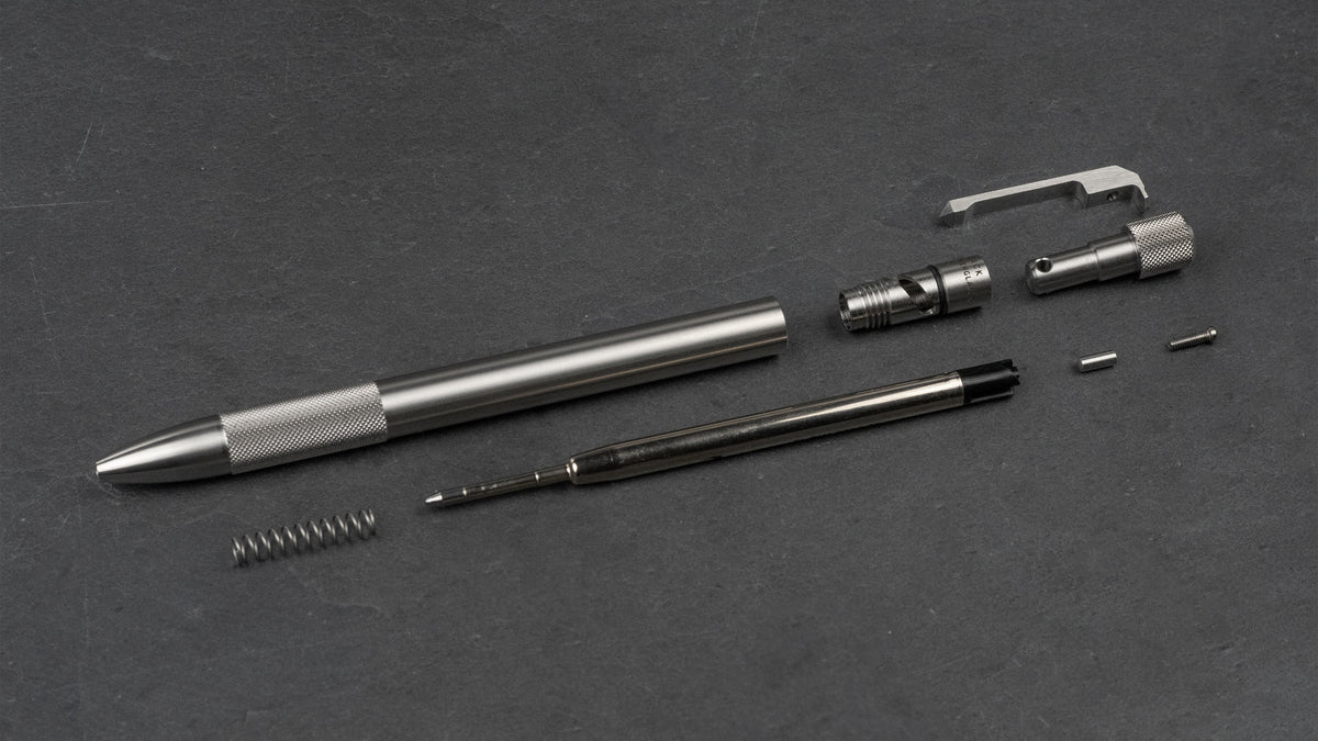 Wingback Journeyman Pen in stainless steel taken apart, showing its G2 refill, spring, clip and twist mechanism