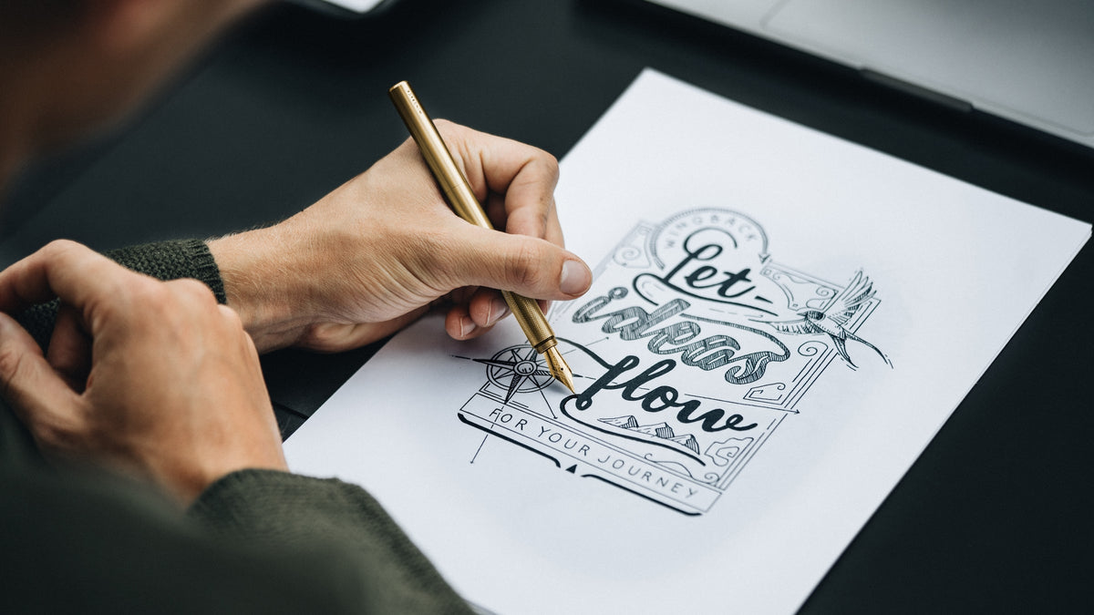 Writing with a brass Wingback Fountain Pen