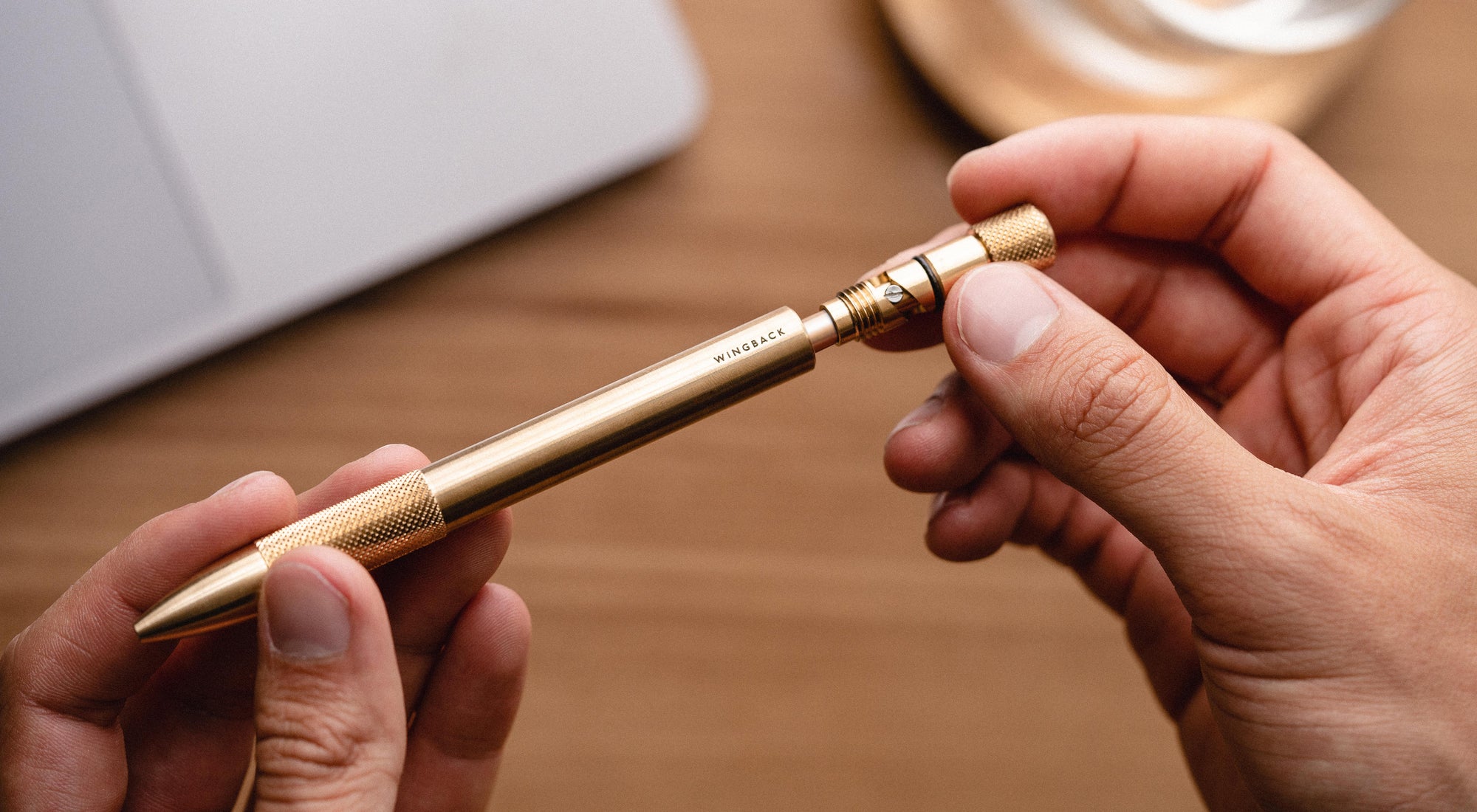Detail of brass Mechanical Pen by Wingback as an example of personalised corporate gifts