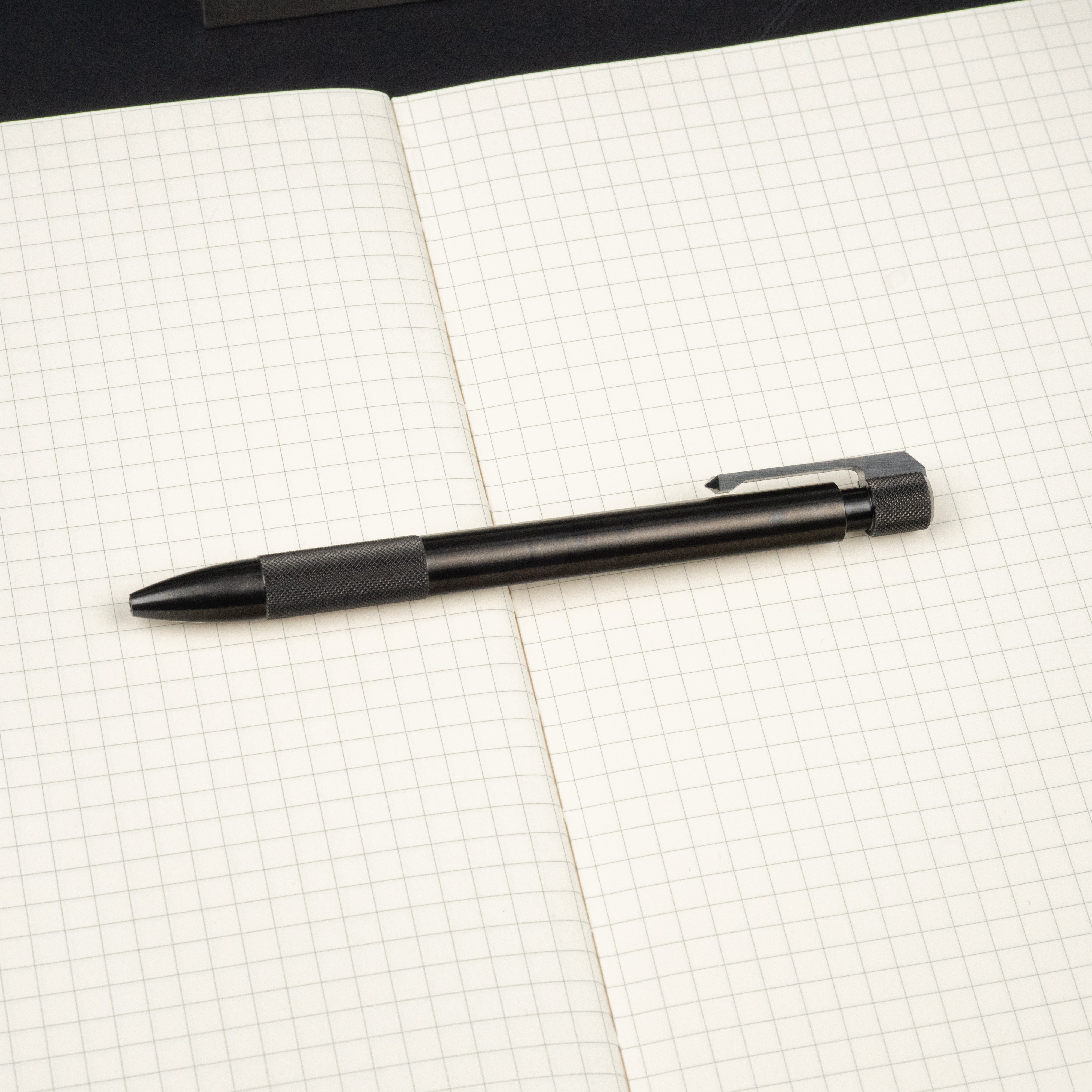 black steel journeyman pen on notebook