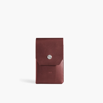 Wingback chestnut leather pen slip holding a pen