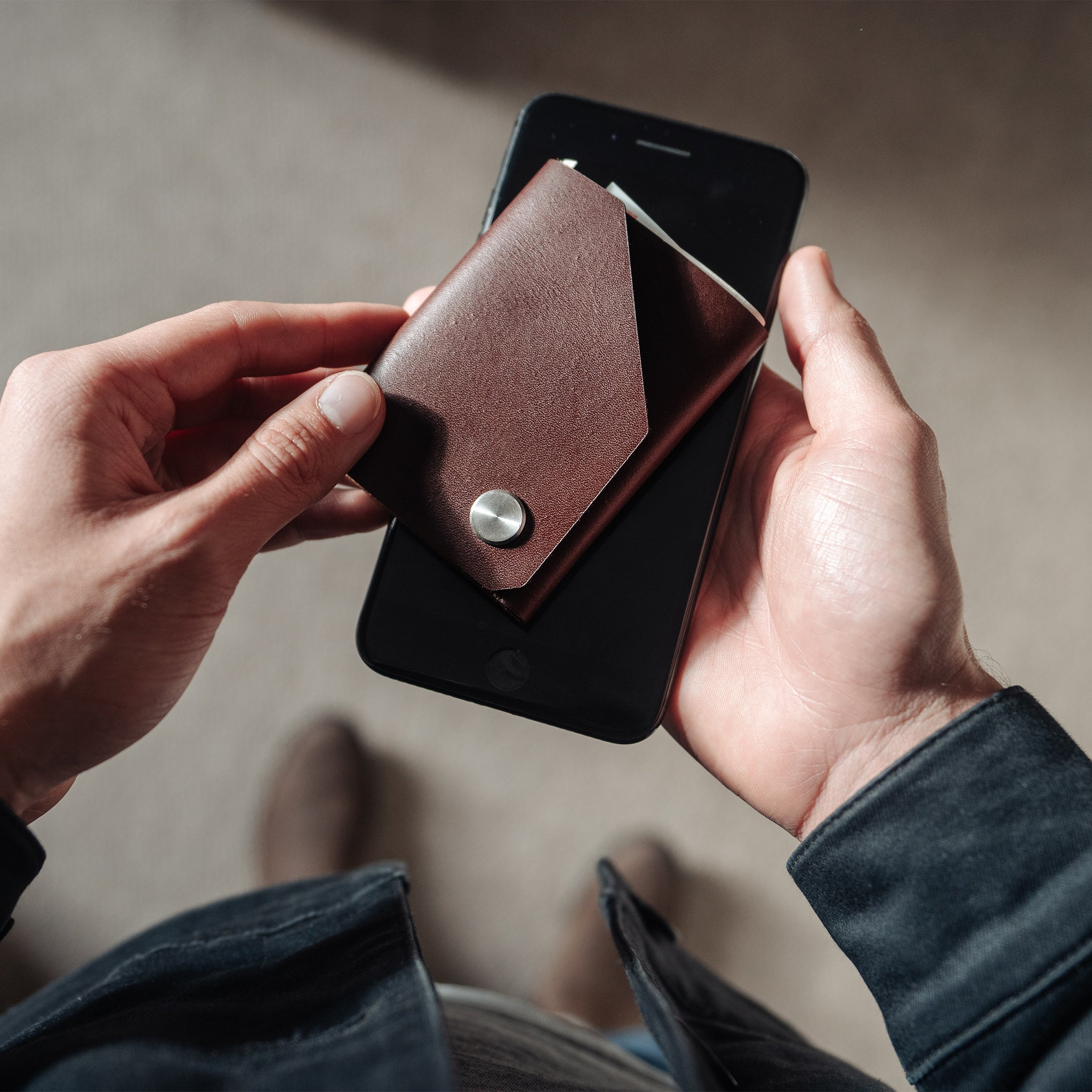 Slim handmade leather wallet in the hands - made by Wingback