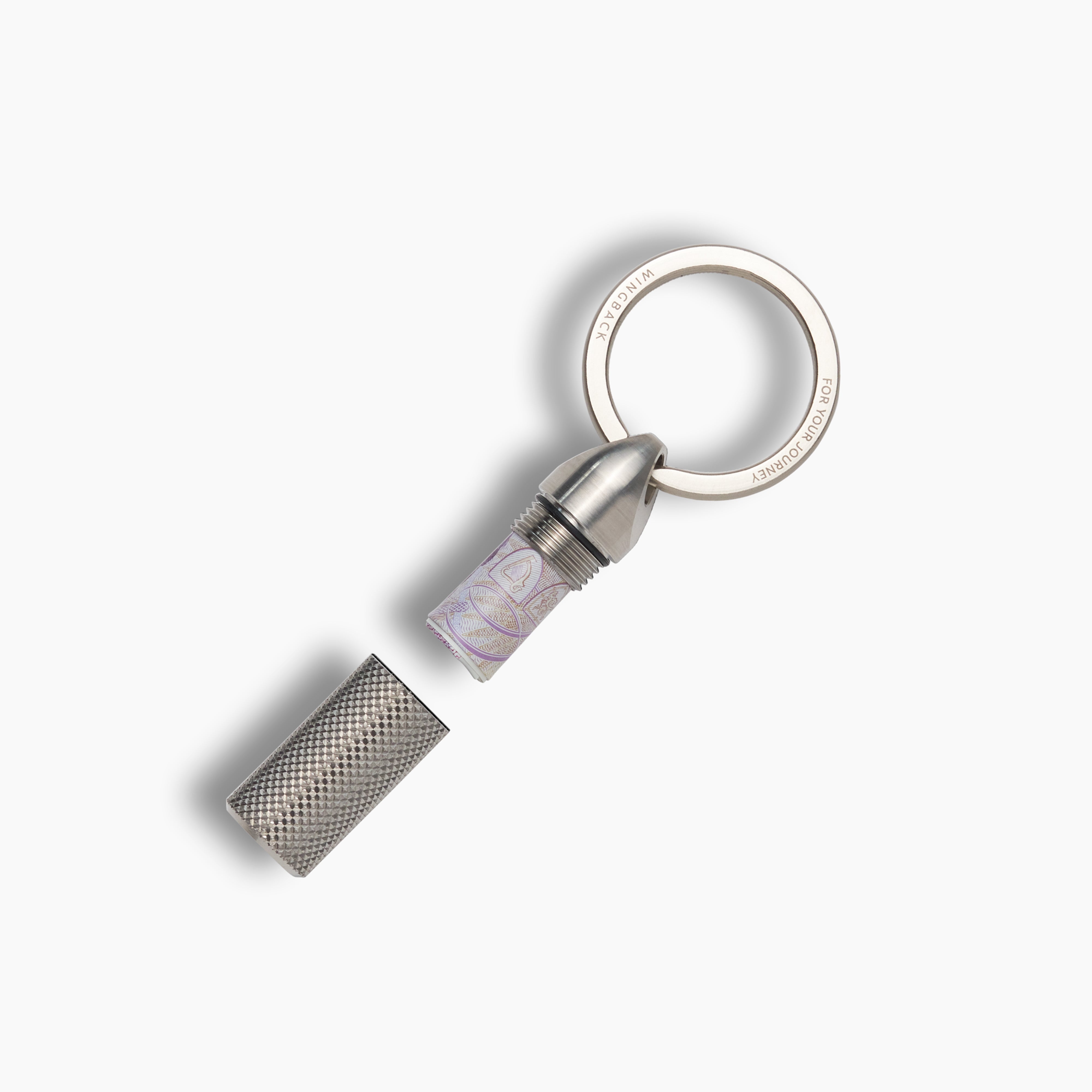 Silver keychain with textured design on a white background