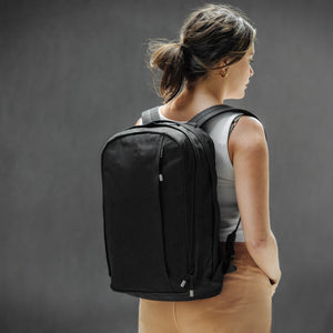 Waxed cotton backpack by Wingback modelled by woman