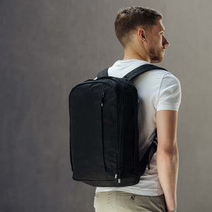 Waxed cotton backpack by Wingback modelled by man